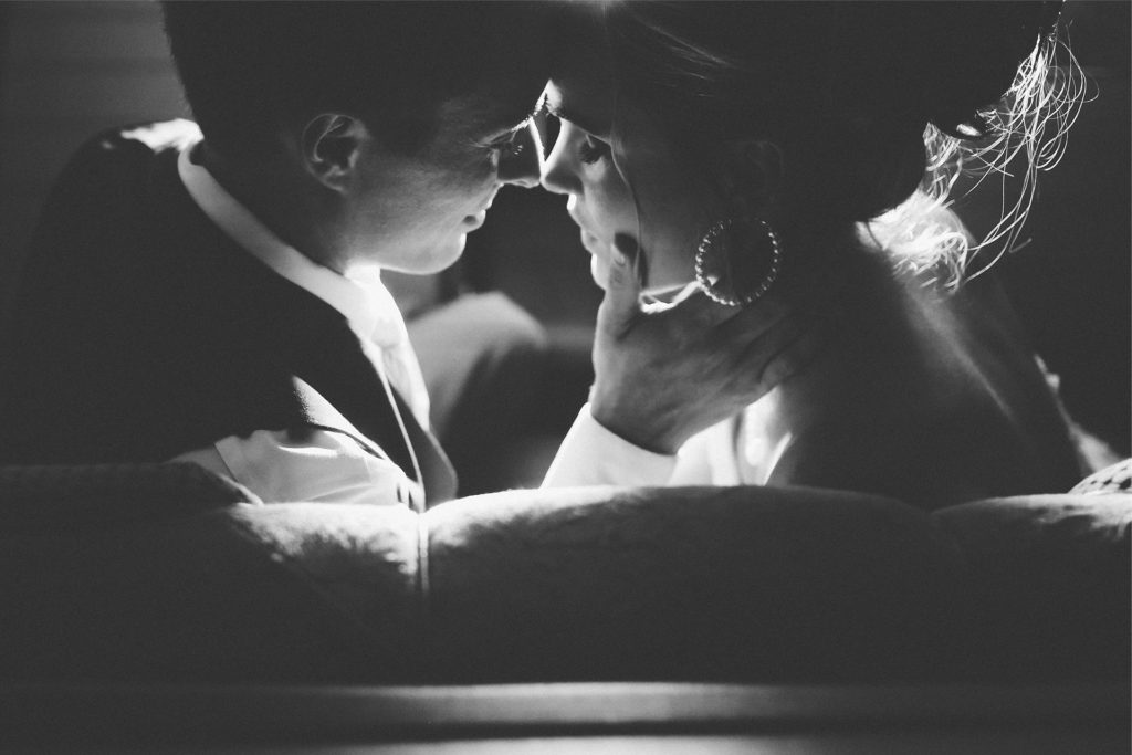 Black and White Photo of Couple on Custom Couch Black and White Photo of Couple Holding Each Other