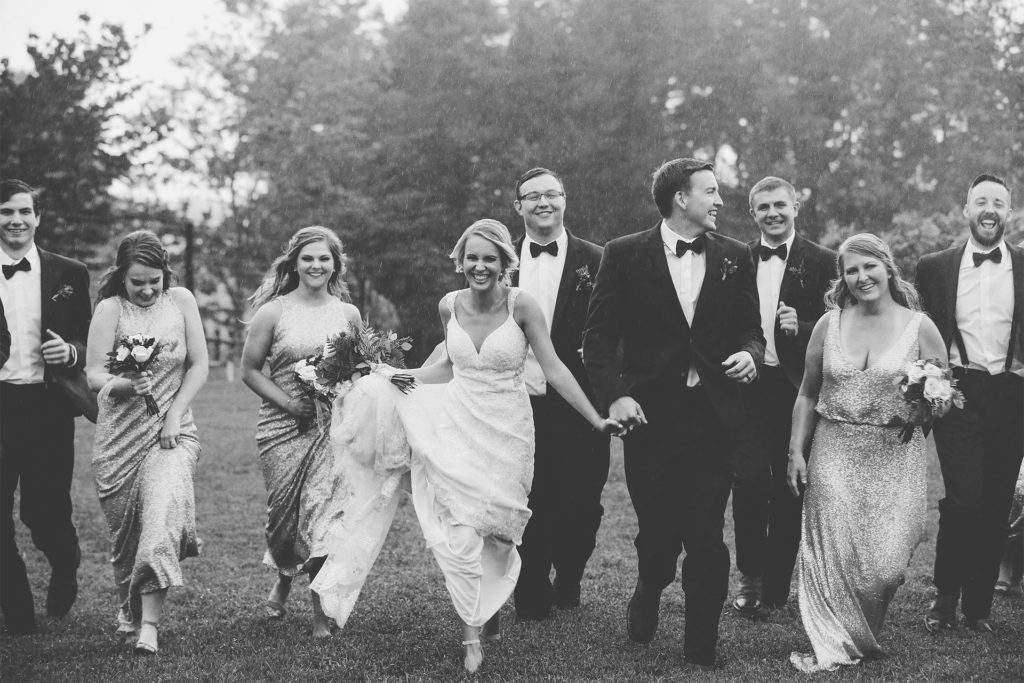 Wedding Group Laughing Before the Ceremony Wedding Party Laughing Together Before Ceremony